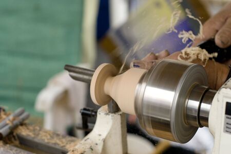 A man carving a piece of artwork.の写真素材
