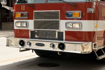 A red emergency vehicle outside.