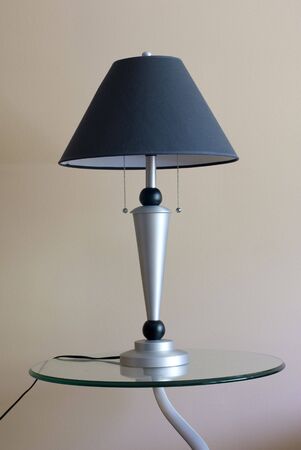 A moden lamp on a table inside a home.の写真素材