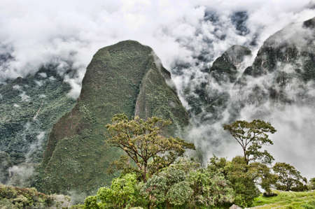 A view from Machu Picchu on a cloudy day.