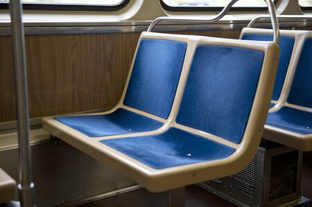 Two seats in a bus made up of four blue squares that are attached to the actual seat.