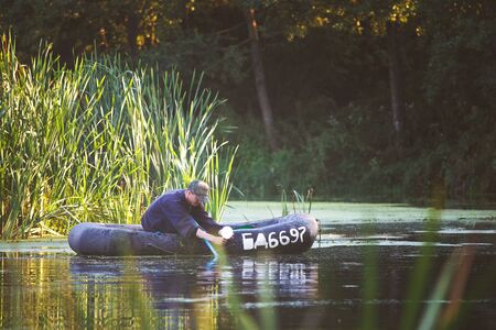 Man fishing pike with floats and live baitsの写真素材
