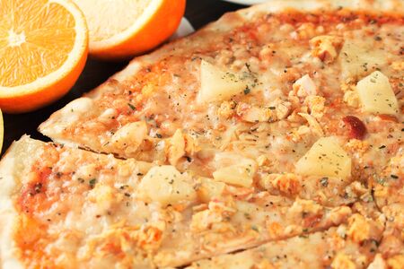 Pizza with exotic fruit and chicken close-up. Shallow depth of fieldの写真素材