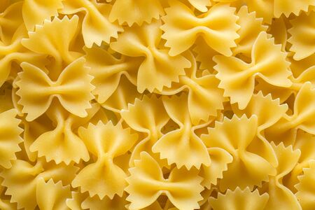 Farfalle italian pasta background. Traditional pasta from aboveの写真素材