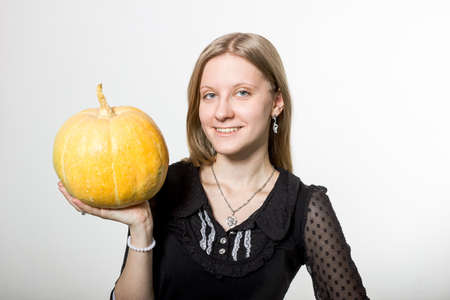 A girl with pumpkin.の写真素材