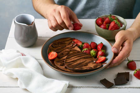 chocolate pancakes with banana and strawberryの写真素材