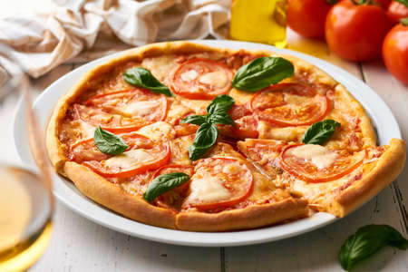 Pizza Margherita is a typical Neapolitan pizzaの写真素材