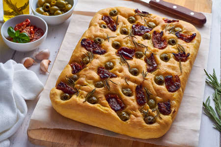 focaccia classic italian bread with rosemary and sun dried tomatoesの写真素材