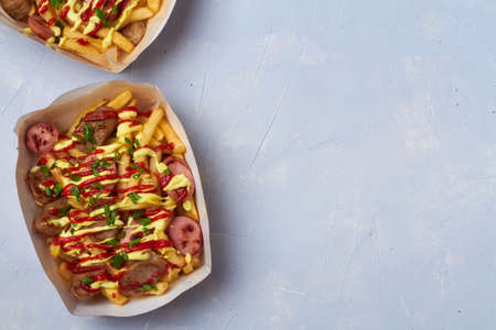 salchipapa, salchipapas traditional street food from Peru with sausages and french friesの写真素材