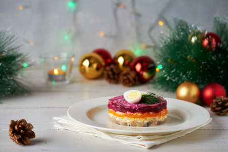 herring under a fur coat russian herring salad happy new year salad with carrot potato beetroot mayonnaise new years tree decorations new years treeの写真素材