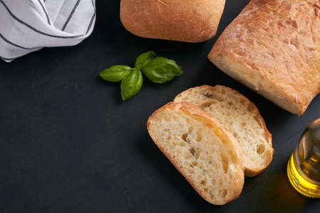 ciabatta is an Italian white bread made from wheat flour water salt yeast olive oil on black...
