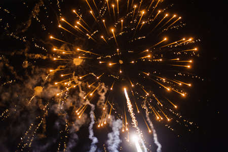 Cluster of colourful fireworks against dark skyの写真素材