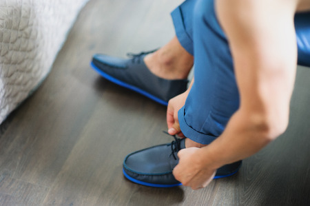 Groom is preparing for his wedding at morningの写真素材