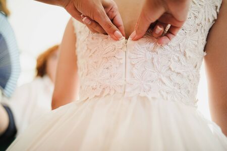 bride getting dressed on her best day everの写真素材