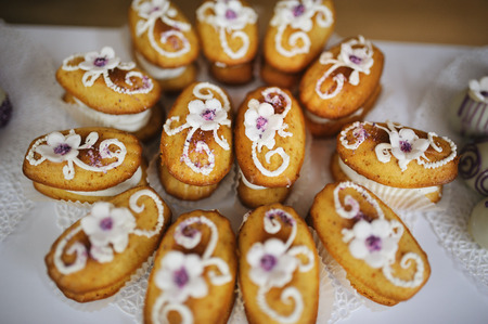 wedding dessert with delicious cakes and macaroonsの写真素材