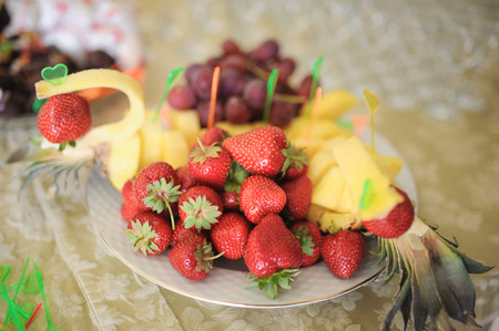 nice looking and tasty pineapple and strawberry on wedding receptionの写真素材