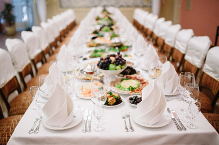 Banquet wedding table setting on evening reception awaiting guests