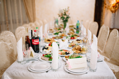 Banquet wedding table setting on evening reception awaiting guests
