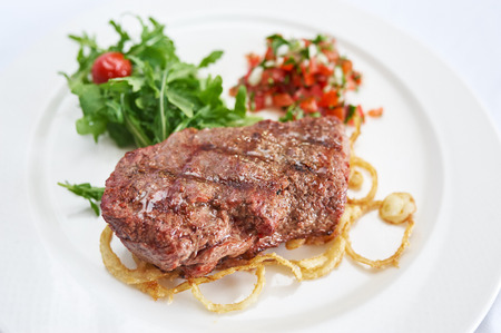 Steak marble on white plate studio shotの写真素材