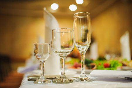 Banquet wedding table setting on evening reception awaiting guestsの写真素材