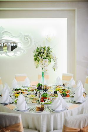 Banquet wedding table setting on evening reception awaiting guestsの写真素材