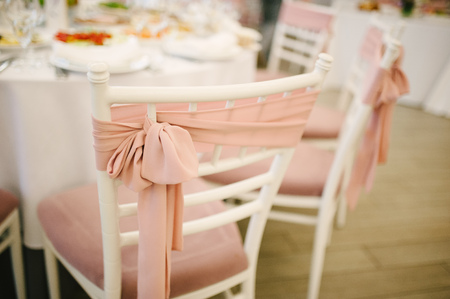 Banquet wedding chairs setting on evening reception awaiting guestsの写真素材