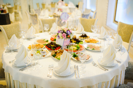 Banquet wedding table setting on evening reception awaiting guests