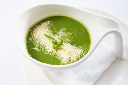 Cream spinach on white plate studio shotの写真素材