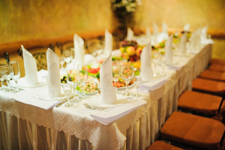 Banquet wedding table setting on evening reception awaiting guestsの写真素材