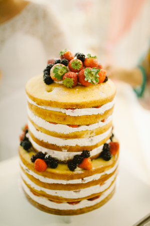wedding cake decorated with berries and strawberriesの写真素材