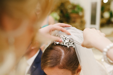 bride get a professional hair style at beauty salonの写真素材