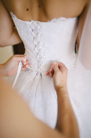 bride getting dressed on her best day everの写真素材