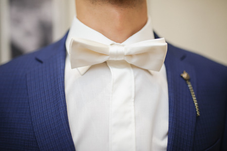 Groom is preparing for his wedding at morningの写真素材