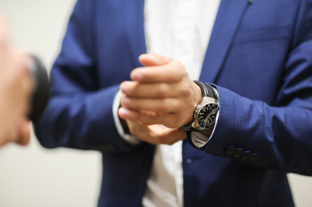 a groom is Getting Ready and showing watchesの写真素材