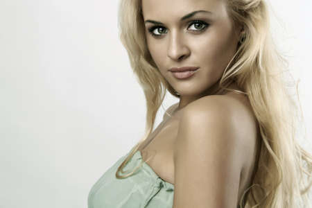 Beautiful fashion blond woman in blue dressの写真素材