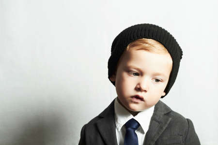sad little boy in suit.style kid. fashion children. emotionの写真素材