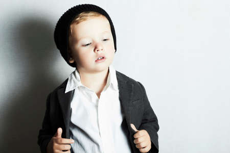 fashionable little boy in cap.stylish kid. fashion childrenの写真素材