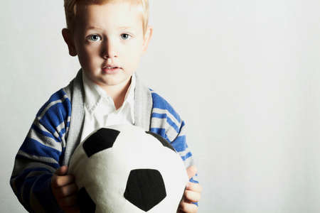 little boy with soccer ball.stylish kid. fashion children.football