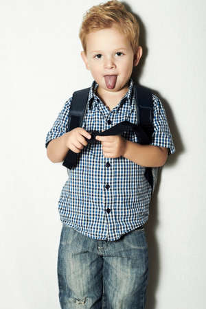 funny little kid.fashion children.emotion.to ngue out of his mouth.like a Einsteinの写真素材