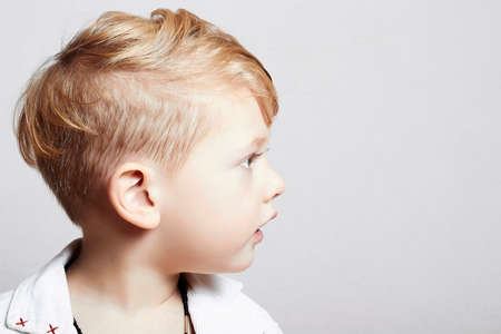 little boy with stylish haircut
