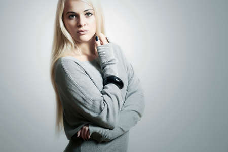 Beautiful blond young woman in dressの写真素材