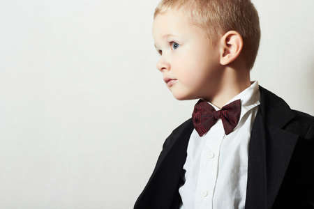 Fashionable Little Boy in Bow tie.Stylish kid. fashion children. 4 Years Old Child in Black Suitの写真素材