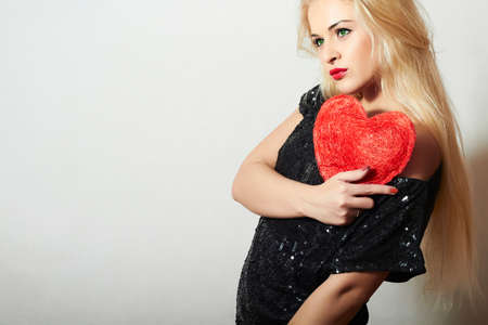 Lovely Beautiful Blond Woman with Red Heartの写真素材