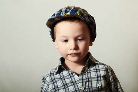 Child. Fashionable Little Boy in Cap. Fashion Children. 4 years old. plaid shirt