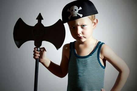 little barbarian.Boy in Carnival Costume.Angry warrior.Fashion Kids. Masquerade.Unusual Uniform.Pirate Child.Halloweenの写真素材