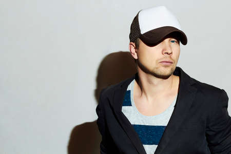 Fashionable Handsome Man. Stylish Boy in cap. Casual Fashion.Young manの写真素材