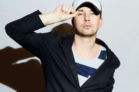 Fashionable Handsome Man. Stylish Boy in cap. Casual Fashion.Young manの写真素材