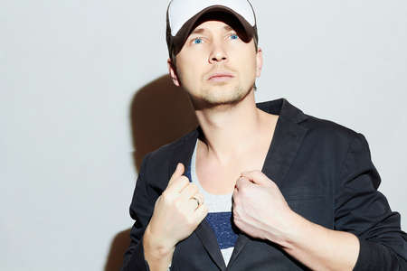 Fashionable Handsome Man. Stylish Boy in cap. Casual Fashion.Young manの写真素材