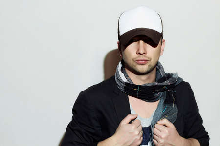 Fashionable Handsome Man in Scarf. Stylish Boy in tracker hat. Casual Fashion.Young man.European styleの写真素材