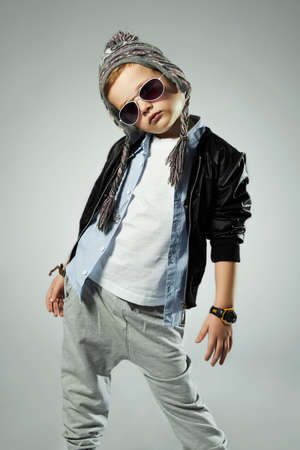 funny little boy in sunglasses.stylish kids. spring fashion childrenの写真素材